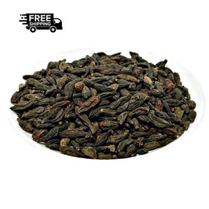 May include: A white ceramic mug with a black handle and the text "But First, Coffee" in a handwritten style. The mug is on a white surface. The mug is approximately 4 inches tall.