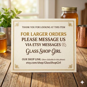 An image saying "Thank you for looking at this item on our Etsy Page. For larger orders please message us via Etsy messages. Glass Shop Girl. For all types of glass containers, lids, caps, corks, pourers and sprays. A great place to shop for wedding favours!  This notice is on a table with glass jars and bottles in the background. -  Etsy UK - Glass Shop Girl