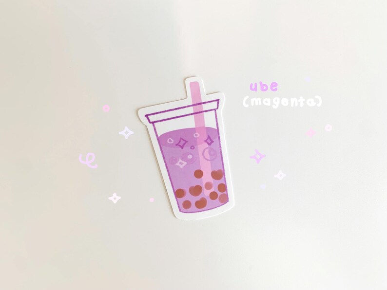 May include: A sticker of a purple ube milk tea with boba pearls and a pink straw. The text "ube (magenta)" is written above the drink.