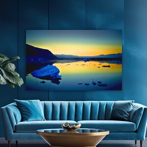 May include: A teal blue velvet sofa with a gold metal coffee table in front of it. The sofa has a tufted back and is in a living room with a large window and a gold floor lamp.