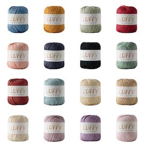 May include: Sixteen skeins of Luffy hand knitting yarn arranged in a grid. Each skein features a white paper band with the text LUFFY printed in gold. The yarn comes in a variety of solid colors including blue, yellow, green, red, pink, black, and beige.