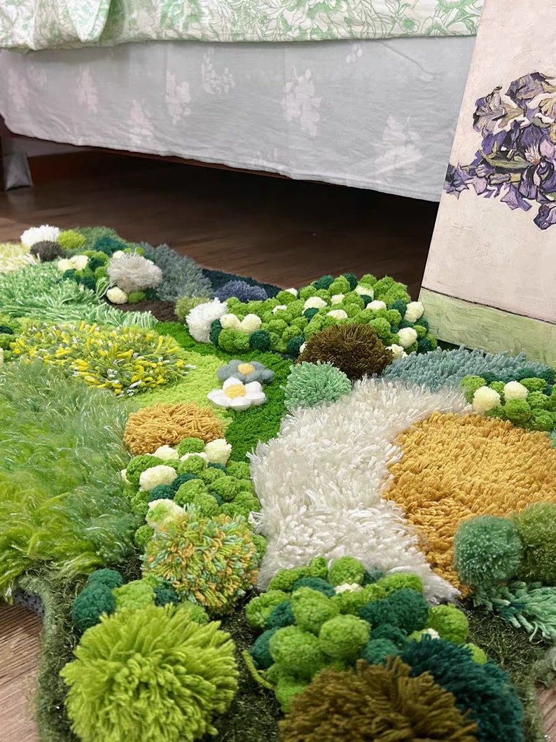 May include: A green, yellow, and white rug with a fluffy texture. The rug is made of yarn and has a variety of different shapes and sizes. The rug is perfect for adding a touch of whimsy to any room.
