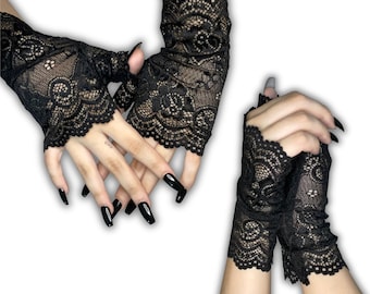 Alt schwarze fingerlose Handschuhe mit Blumenspitze