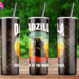 May include: A 20 ounce skinny stainless steel tumbler with a black and gray metal pattern. The tumbler features a retro-style graphic of Godzilla with the text "Dadzilla, Father of the Monsters".
