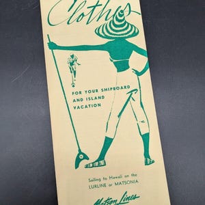 May include: A vintage brochure for Matson Lines, a cruise line, with a green illustration of a woman in a striped hat and a man playing shuffleboard. The text reads "Clothes for your shipboard and island vacation. Sailing to Hawaii on the LURLINE or MATSONIA. Matson Lines."