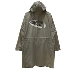 May include: A gray hooded jacket with a white logo that says "Alien Defence Projects Beschwa" on the back.