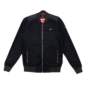 May include: Black bomber jacket with a full-length zipper, two front pockets, and a small logo on the chest. The jacket has dark gray accents on the shoulders, cuffs, and hem. The interior lining is visible at the collar.