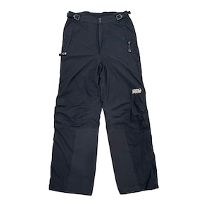 May include: Black snow pants with adjustable waist straps, a zippered pocket, and the "ZERO POINT" logo in orange and white. The pants have reinforced panels on the knees and lower legs.