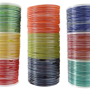 May include: A set of 30 colorful glass bangles. The bangles are stacked in three groups of ten. Each group has a different color scheme: green, yellow, and red; orange, green, and black; and blue, red, and green.