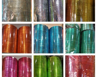 May include: A collection of colorful metal bangles in various shades of silver, gold, orange, blue, green, and red. The bangles are stacked and arranged in rows, showcasing their shiny metallic finish.