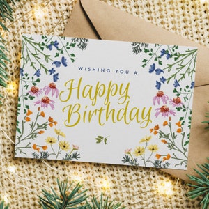 Cartão de feliz aniversário com flores coloridas brilhantes do arco-íris