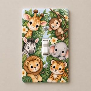 May include: A rectangular light switch cover plate featuring a colorful jungle scene with a giraffe, monkey, zebra, elephant, lion, and tiger surrounded by green leaves and small yellow flowers. The plate has a central toggle switch and two screws.