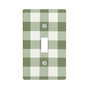 May include: A rectangular light switch wall plate featuring a sage green and white gingham check pattern. The plate includes a central vertical rectangular cutout for a toggle switch and two silver-colored metal screws positioned above and below.