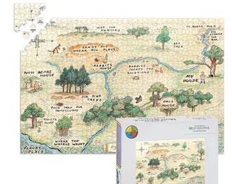 May include: A completed jigsaw puzzle featuring a map of a whimsical landscape with text like "Pooh Bears House" and "Sandy Pit Where Roo Plays." The puzzle is tan, green, and brown. The puzzle box is white with a colorful logo and the words "The World's Most Beautiful Jigsaw Puzzles."