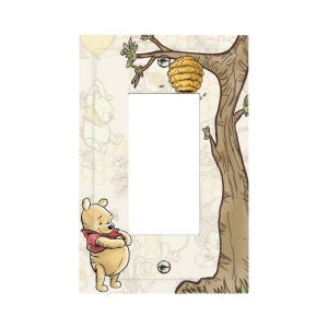 May include: A decorative light switch cover featuring Winnie the Pooh. The design includes a tree with a beehive, Pooh Bear, and a background with honeycombs and Pooh Bear illustrations. The cover is rectangular with a single switch opening.