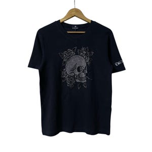 Skull Embellished Tattoo Design By Be For Company - Size L