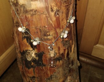 Perfume Bottle and Bead Necklace