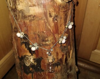 Perfume Bottle and Bead Necklace