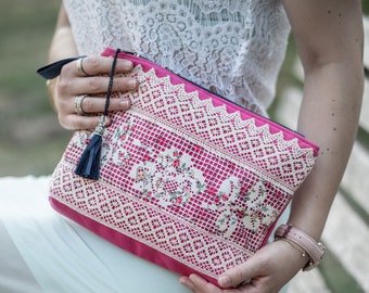 Rose is a clutch bag, a wristlet pouch.