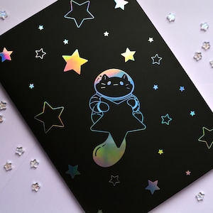 Silver holographic foil stickerbook with sewn edging