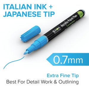 May include: A blue acrylic paint pen with a 0.7mm extra fine tip. The pen is labeled "SAMA Acrylic Paint Pen 0.7mm Extra Fine Tip Art For Everyone". The text "ITALIAN INK + JAPANESE TIP" is displayed above the pen. The pen is on a white surface and a blue line is drawn with the pen.
