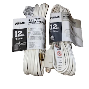 May include: Two white 12 ft. (3.66m) 3-outlet household extension cords. Each cord is coiled and has a label with product information. The cords are polarized and have a 2-conductor design.