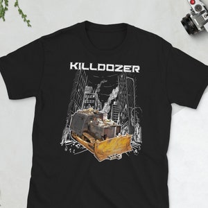 May include: Black t-shirt with a white graphic of a bulldozer in a city setting. The text "KILLDOZER" is above the bulldozer.