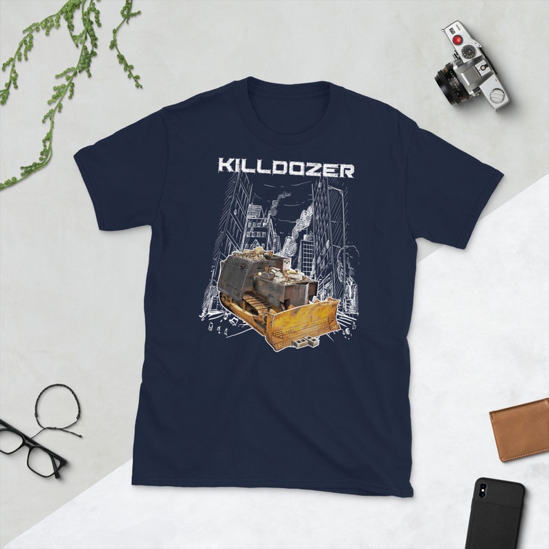May include: Navy blue t-shirt with a white graphic of a bulldozer in a city setting. The text "KILLDOZER" is printed above the bulldozer.