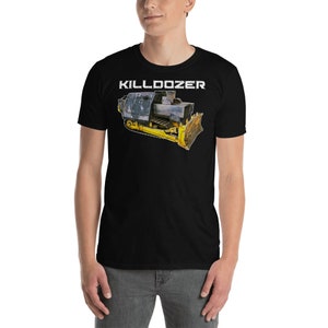 May include: Black t-shirt featuring a white graphic of a yellow and black bulldozer with the text "KILLDOZER" above it.