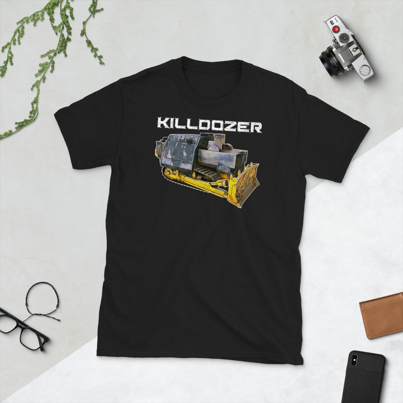 May include: Black t-shirt featuring a yellow and black bulldozer graphic with the text "KILLDOZER" in white.
