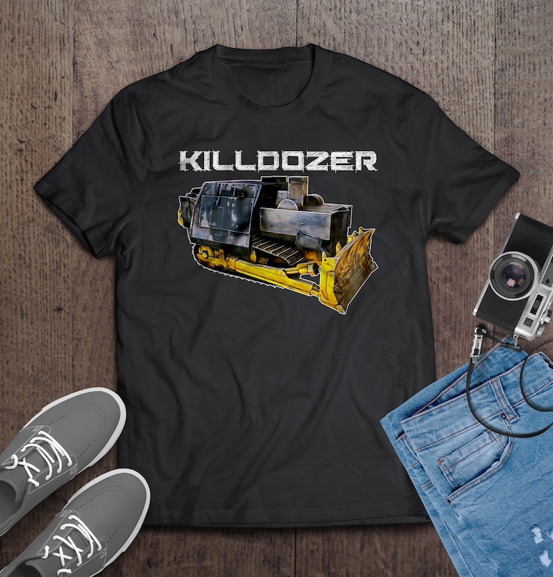 May include: Black t-shirt featuring a yellow and black bulldozer graphic with the text "KILLDOZER" in white.