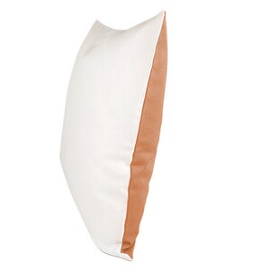 May include: A white pillow with a brown accent on one side. The pillow is made of a soft, comfortable fabric.