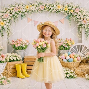 May include: A young girl in a yellow dress and straw hat holds a bouquet of tulips. The background features an Easter-themed display with flowers, eggs, and yellow rain boots. The scene is decorated with a floral arch and wooden crates.