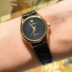 Vintage Armbanduhr / Schmale schwarze Band-Quarzuhr von Le Chat