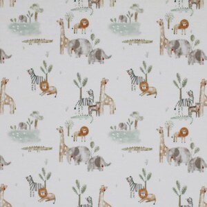 May include: White fabric with a repeating pattern of safari animals. The design includes giraffes, lions, zebras, elephants, and crocodiles, along with stylized trees and grassy areas. The animals are in shades of brown, gray, and orange.