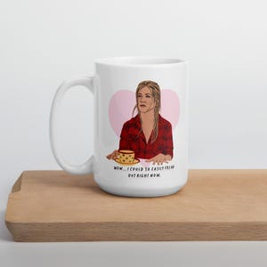 Op de afbeelding: Witte keramische mok met een cartoon illustratie van een vrouw in een rood geruit overhemd, tegen een roze hart achtergrond. De mok heeft de tekst: "WOW... I COULD SO EASILY FREAK OUT RIGHT NOW."