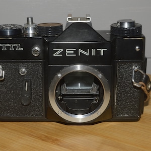 Fantastic Zenit TTL 35mm Film Camera with Strap. Solidly built camera.