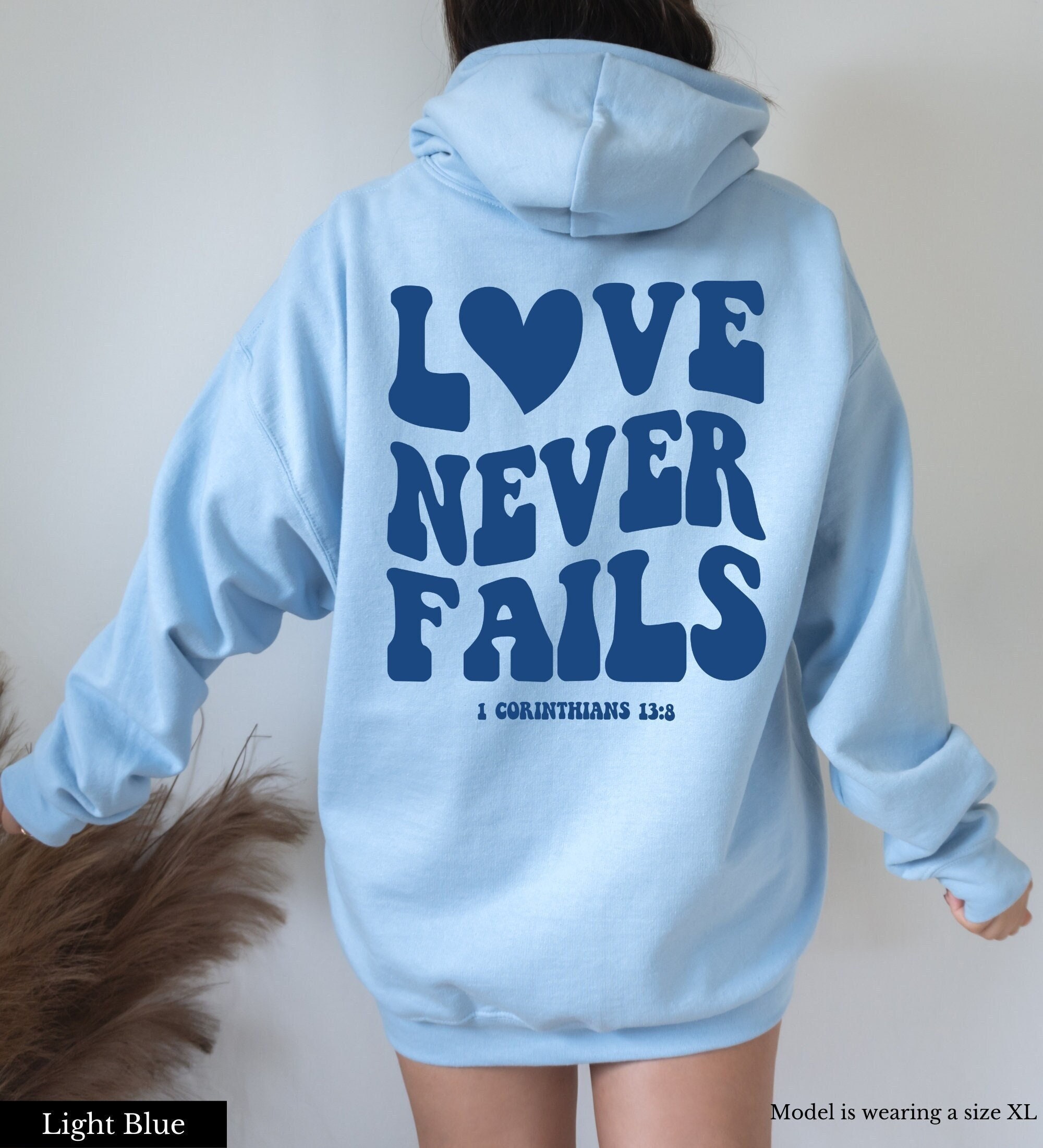 Love Never Fails Christian Hoodie - Fabrics Of Faith