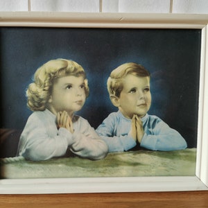 Vintage print with praying children in a wooden frame
