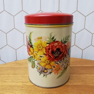 Vintage tin/container with flower image