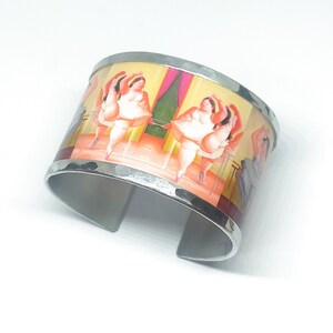 Aluminum bracelet inspired by the dancer at the pole by Fernando Botero. Personalized text