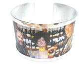 Aluminum bracelet inspired by a toast between Klimt, Judith and Dali. Personalized text