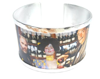 Aluminum bracelet inspired by a toast between Klimt, Judith and Dali. Personalized text