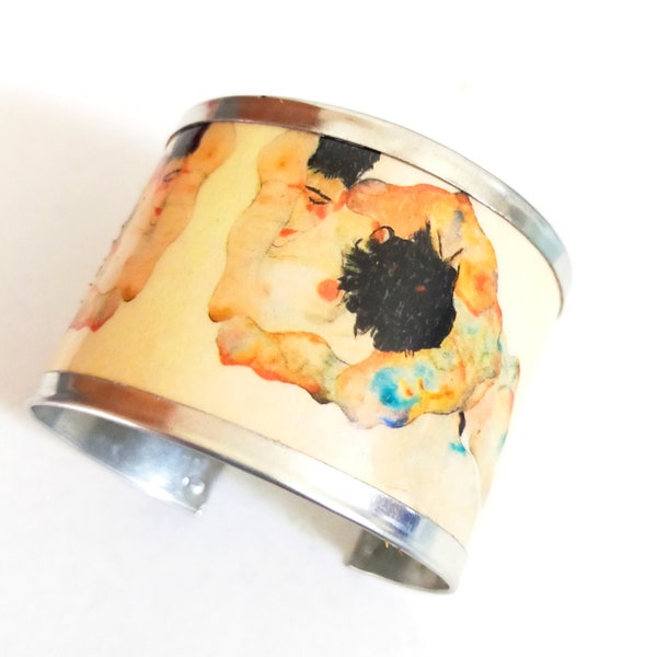 Bracelet inspiré par l'étreinte d'Egon Schiele (aquarelle). Fabriqué avec aluminium. Texte interne personnalisé.