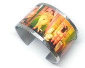 Aluminum bracelet inspired by nude woman by Fernando Botero. Personalized text