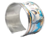 Bracelet - bangle  inspired in Dali,  made with aluminum. Personalized text on the inside. Model Dali 1