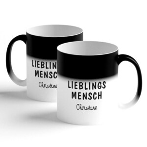 Może przedstawiać: Dwa czarno-białe kubki zmieniające kolor z tekstem "Lieblings Mensch Christine".