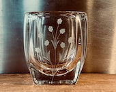 Charming thick crystal vase engraved with small white flowers very delicate on the front, oval shape with flat faces.