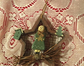 Angel in a star christmas ornament