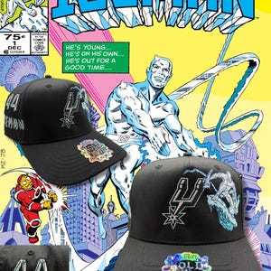 May include: Black baseball caps with embroidered designs and the text "44 ICEMAN". The caps are displayed in front of a vintage "Iceman" comic book cover featuring a superhero.